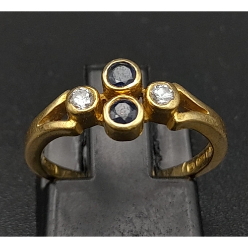 32 - A Vintage 18K Yellow Gold Diamond and Sapphire Ring. Two vertical sapphires and two horizontal diamo... 