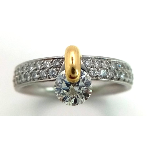 120 - A Gorgeous 950 Platinum and 18K Gold and Diamond Ring with Diamond Shoulders. 0.76ct brilliant centr... 