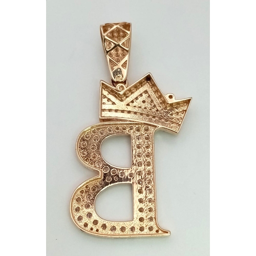 179 - A 9K YELLOW GOLD STONE SET INITIAL B PENDANT. TOTAL WEIGHT 5.4G. TOTAL LENGTH 3.5CM.