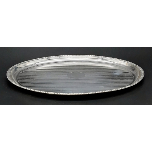 22 - A Small Antique 925 Silver Oval Tray. Machine tooled geometric decoration with empty cartouche. Hall... 