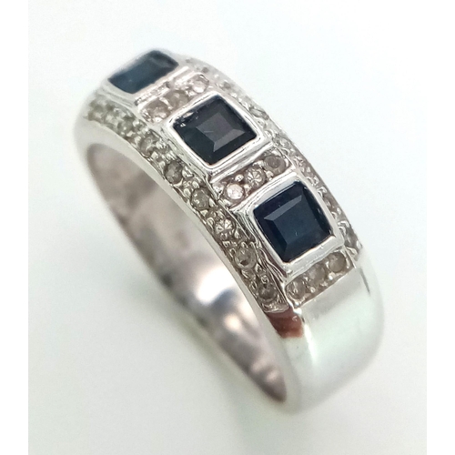 235 - A 9K WHITE GOLD DIAMOND & SAPPHIRE RING 0.18CT DIA & 0.30CT SAPPHIRES. TOTAL WEIGHT 4.37 G. SIZE N