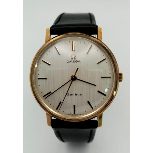 45 - A Beautiful Vintage 9K Gold Omega Geneve Gents Watch. Black leather strap. 9K gold case - 34mm. Whit... 