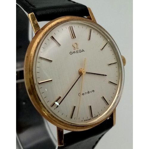 45 - A Beautiful Vintage 9K Gold Omega Geneve Gents Watch. Black leather strap. 9K gold case - 34mm. Whit... 