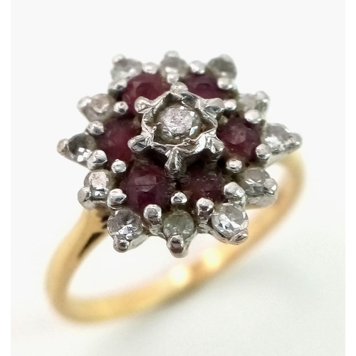 53 - 18K YELLOW GOLD DIAMOND & RUBY CLUSTER RING. TOTAL WEIGHT 3.4G. SIZE K