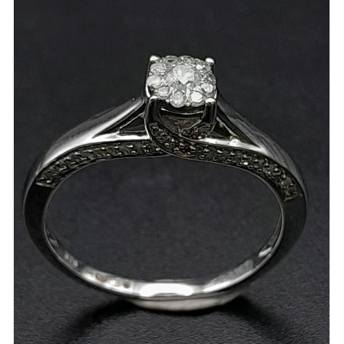 214 - 9K WHITE GOLD DIAMOND RING WITH DIAMOND SET PROFILE.  0.33CT DIAMOND. TOTAL WEIGHT 2.6G.  SIZE P