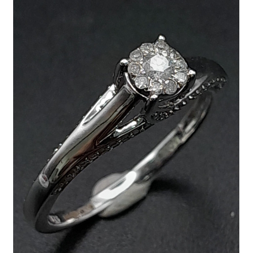 214 - 9K WHITE GOLD DIAMOND RING WITH DIAMOND SET PROFILE.  0.33CT DIAMOND. TOTAL WEIGHT 2.6G.  SIZE P