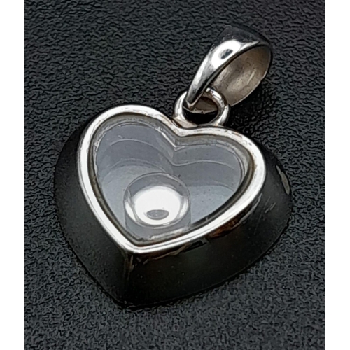 228 - 18K WHITE GOLD FLOATING DIAMOND HEART PENDANT / CHARM. TOTAL WEIGHT 2.2G