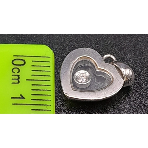 228 - 18K WHITE GOLD FLOATING DIAMOND HEART PENDANT / CHARM. TOTAL WEIGHT 2.2G