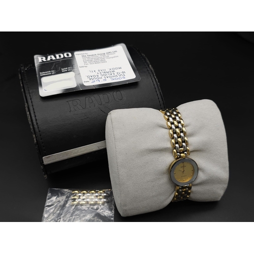 253 - A Rado 'Florence' Quartz Ladies Watch. Two tone bracelet and case - 23mm. Gold tone dial. Comes with... 