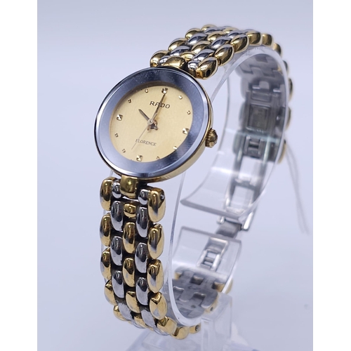 253 - A Rado 'Florence' Quartz Ladies Watch. Two tone bracelet and case - 23mm. Gold tone dial. Comes with... 