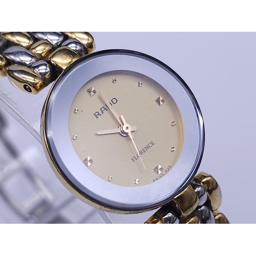 253 - A Rado 'Florence' Quartz Ladies Watch. Two tone bracelet and case - 23mm. Gold tone dial. Comes with... 