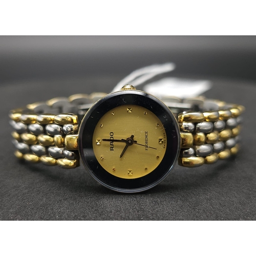 253 - A Rado 'Florence' Quartz Ladies Watch. Two tone bracelet and case - 23mm. Gold tone dial. Comes with... 