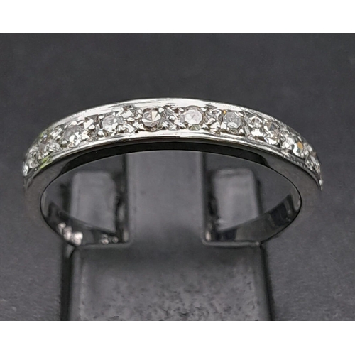 271 - 9K WHITE GOLD DIAMOND 1/2 ETERNITY RING.  0.22CT DIAMOND. TOTAL WEIGHT 1.8G.  SIZE O