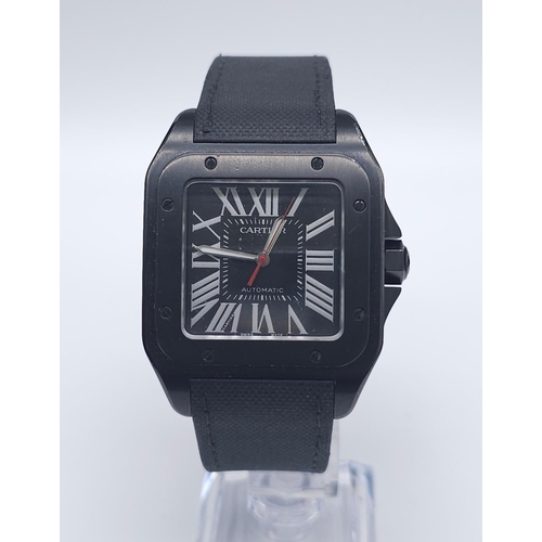 55 - A Stylish Cartier Santos 100 Automatic Gents Watch. Leather and textile strap. Black stainless steel... 