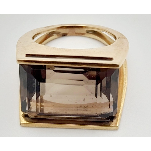 204 - Three 9K Gold Pieces of Jewellery: A 9K yellow gold smoky quartz ring - size M - 9.37g. A  9k white ... 