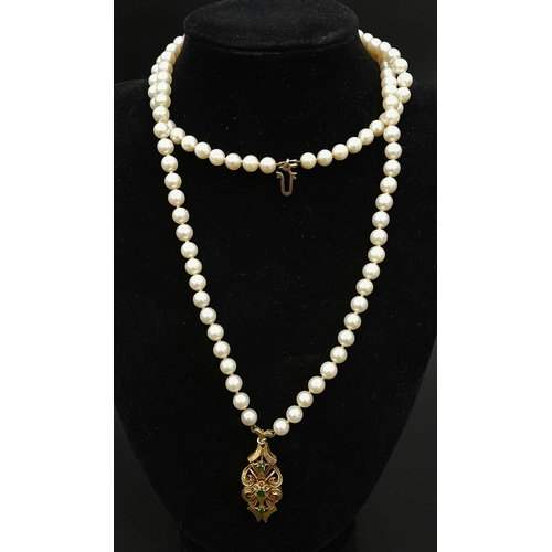 225 - Two Vintage Natural Pearl Necklaces. Both similar in nature with decorative 18k Gold gemstone pendan... 