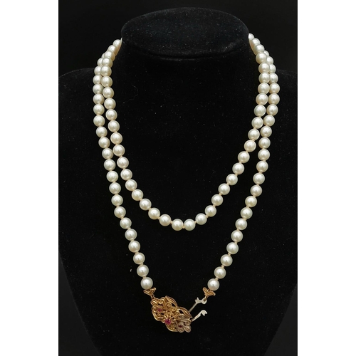 225 - Two Vintage Natural Pearl Necklaces. Both similar in nature with decorative 18k Gold gemstone pendan... 