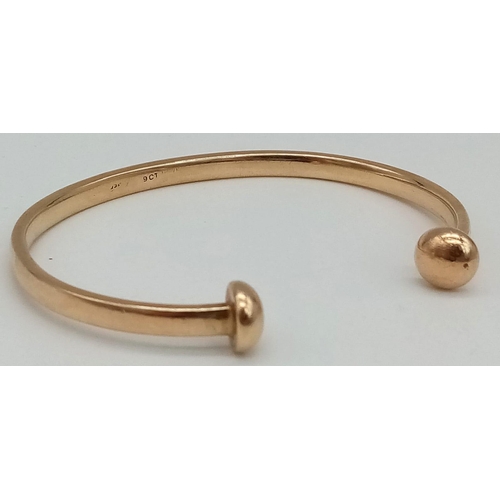 309 - 9k yellow gold torque bangle (3cm opening). Total Weight 20.3g