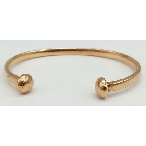 309 - 9k yellow gold torque bangle (3cm opening). Total Weight 20.3g