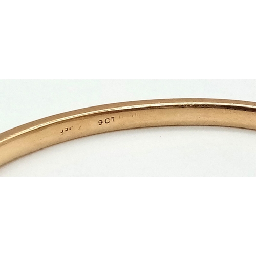 309 - 9k yellow gold torque bangle (3cm opening). Total Weight 20.3g