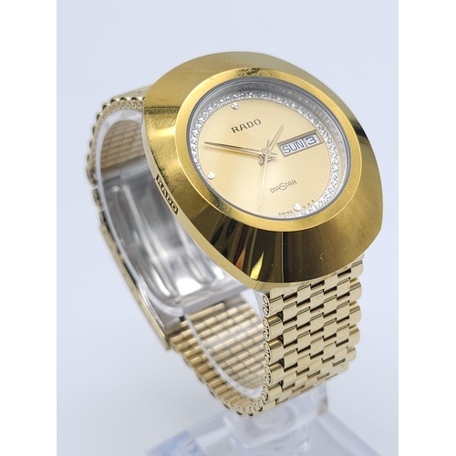 407 - A Gold Plated Rado Diastar Unisex Watch. Gold plated bracelet and case - 36mm. Gold tone dial with d... 