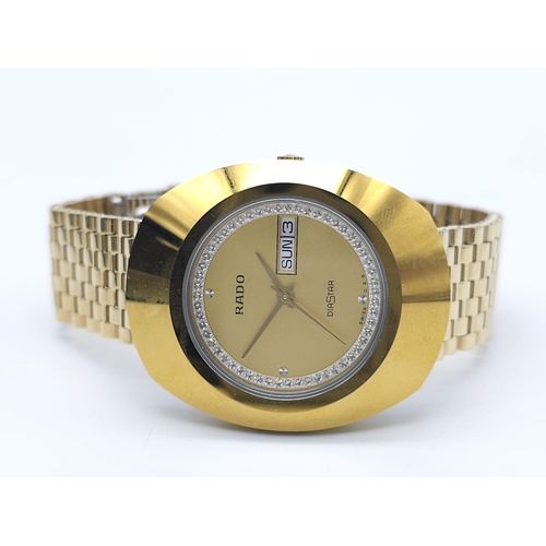 407 - A Gold Plated Rado Diastar Unisex Watch. Gold plated bracelet and case - 36mm. Gold tone dial with d... 