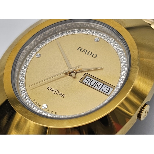 407 - A Gold Plated Rado Diastar Unisex Watch. Gold plated bracelet and case - 36mm. Gold tone dial with d... 