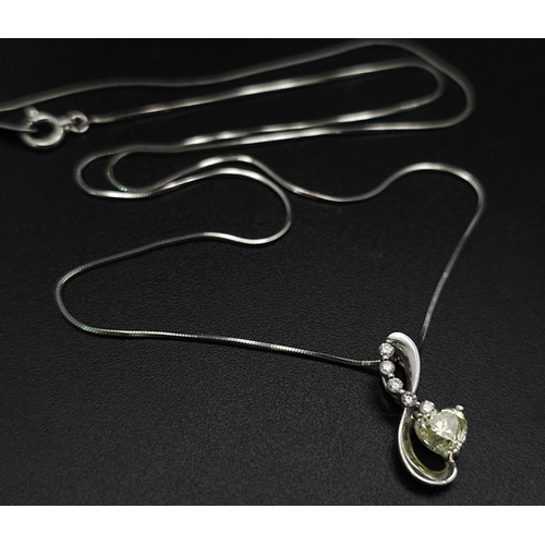 1743 - A Platinum, Diamond And Champagne Diamond Pendant on A Platinum Necklace. Total Weight 3.54g