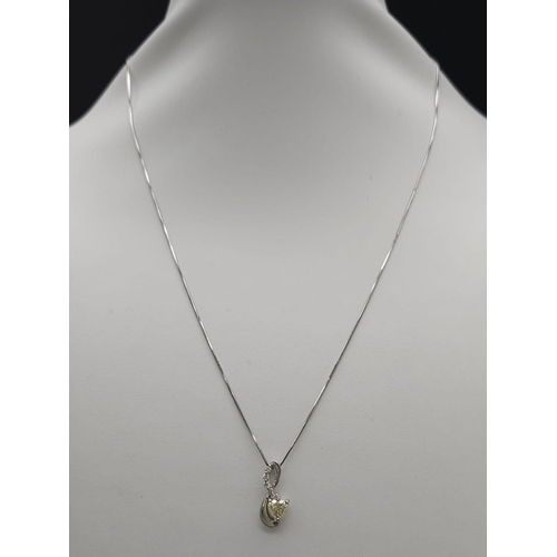 1743 - A Platinum, Diamond And Champagne Diamond Pendant on A Platinum Necklace. Total Weight 3.54g