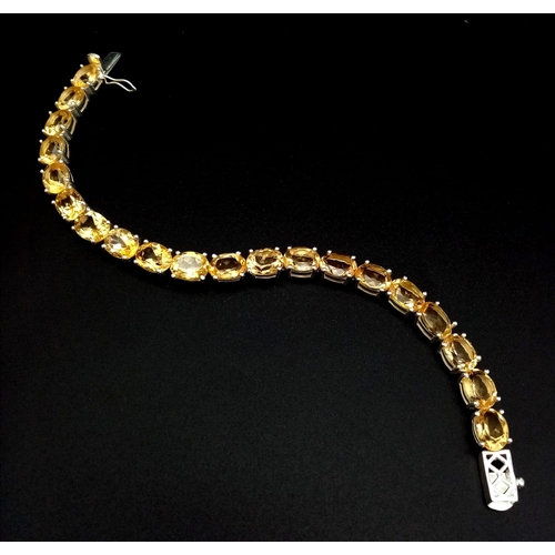 1749 - A Citrine Gemstone Tennis Bracelet set in 925 Silver. Beautiful, clean citrines. 20cm.  20.58g.