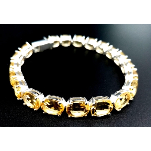 1749 - A Citrine Gemstone Tennis Bracelet set in 925 Silver. Beautiful, clean citrines. 20cm.  20.58g.