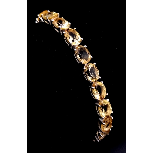 1749 - A Citrine Gemstone Tennis Bracelet set in 925 Silver. Beautiful, clean citrines. 20cm.  20.58g.