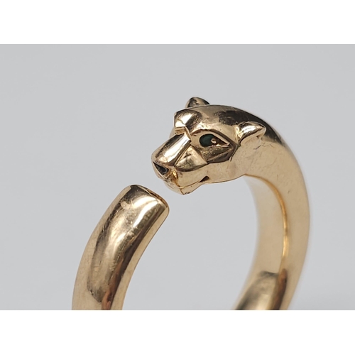 12 - A Cartier 18K Rose Gold Panther Ring with Onyx and Tsavorite Eyes. Size O. 11.1g total weight. Comes... 