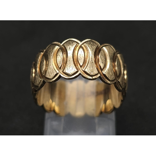 323 - 9k yellow gold oval patterned wide band ring (9mm width). total weight 6.4g, size N