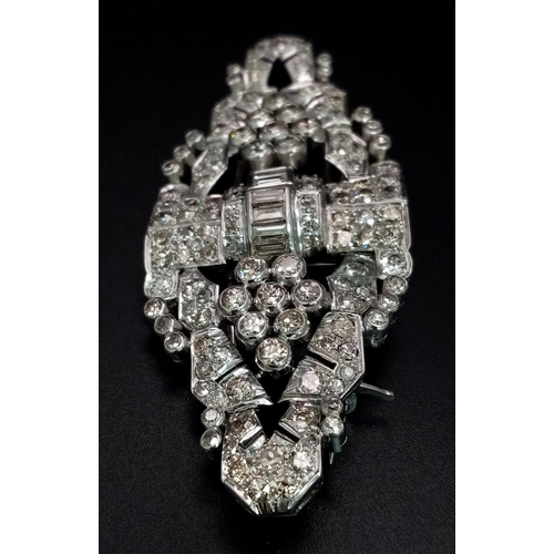 108 - An Art Deco Style 18K White Gold and Diamond Double Clip Brooch. 2ct approx. of round brilliant and ... 