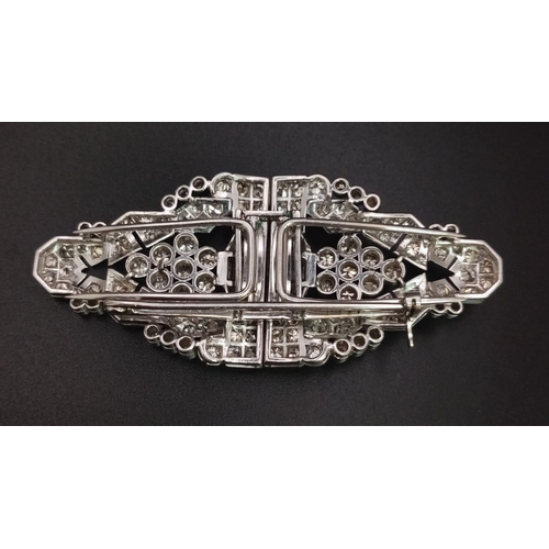 108 - An Art Deco Style 18K White Gold and Diamond Double Clip Brooch. 2ct approx. of round brilliant and ... 