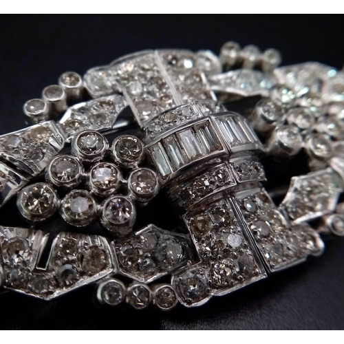 108 - An Art Deco Style 18K White Gold and Diamond Double Clip Brooch. 2ct approx. of round brilliant and ... 