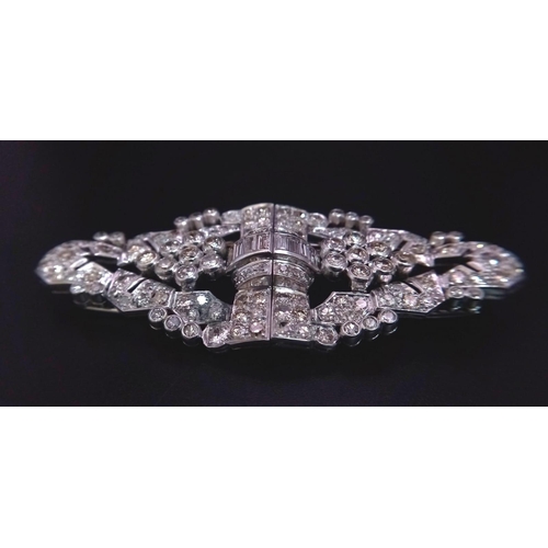 108 - An Art Deco Style 18K White Gold and Diamond Double Clip Brooch. 2ct approx. of round brilliant and ... 