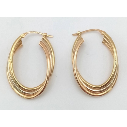 383 - A Pair of 9K Tri-Colour Elongated Twist Hoop Earrings. 3cm. 3.4g total weight.