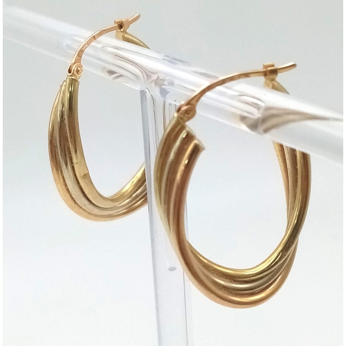 383 - A Pair of 9K Tri-Colour Elongated Twist Hoop Earrings. 3cm. 3.4g total weight.