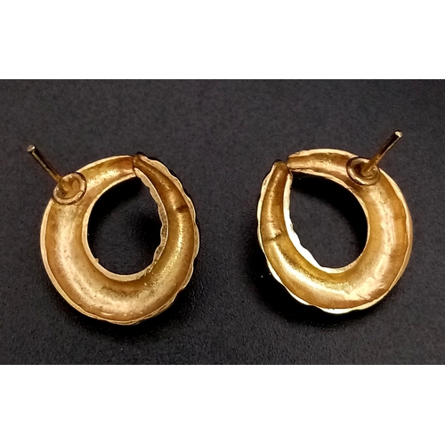 390 - A Pair of 9K Yellow Gold Twist Hoop Earrings. 5.45g total weight. No butterflies.