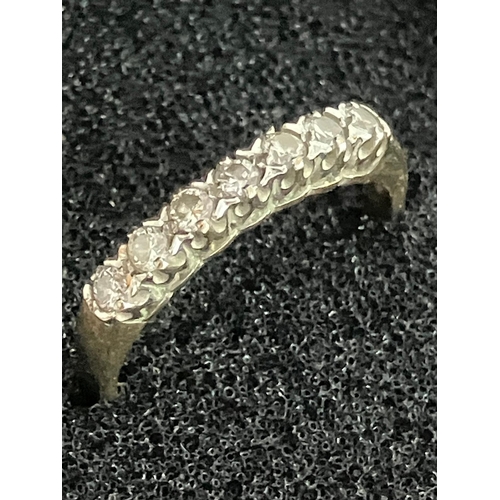 84 - 9 carat GOLD and DIAMOND RING Having seven clear white sparkling DIAMONDS  set to top in line format... 