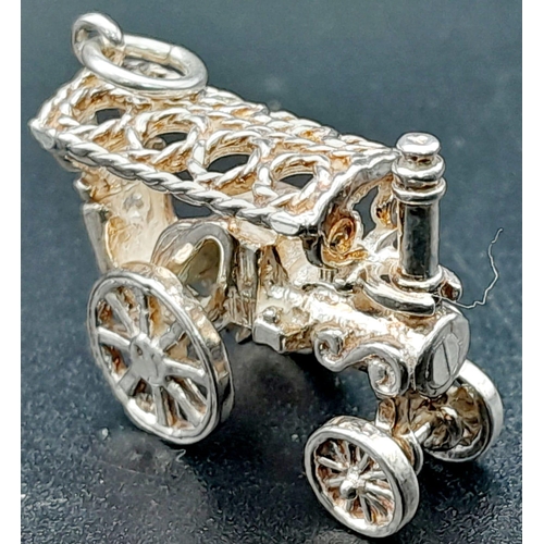 939 - Sterling silver collection of vintage charms, including an opening jug, steam car and train (total w... 