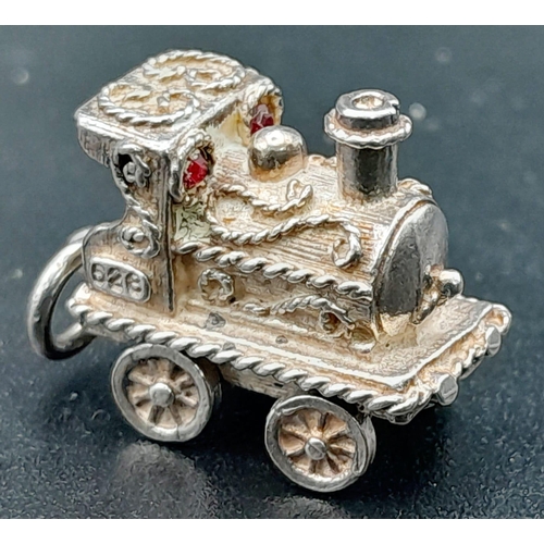 939 - Sterling silver collection of vintage charms, including an opening jug, steam car and train (total w... 