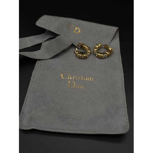 414 - A Pair of Designer Christian Dior Gold Plated Hoop Earrings. White stone decoration. Comes with a Di... 