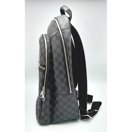 72 - A LOUIS VUITTON DAMIER BACKPACK IN GRAPHITE COLOUR. WITH A FRONT ZIPPERED COMPARTMENT AND ZIPPER POC... 