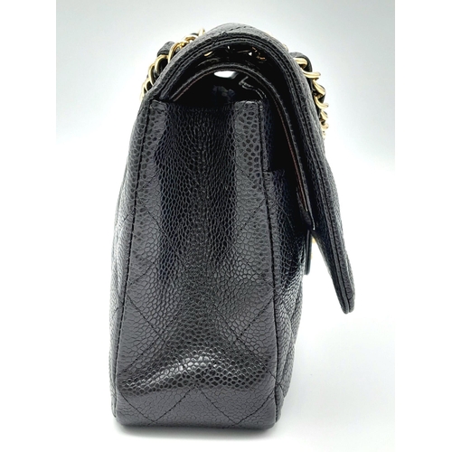 31 - A VINTAGE BLACK CAVIAR LEATHER CHANEL FLAP BAG. 24K GOLD PLATED HARDWARE. LOVELY INTERIOR POCKETS CO... 