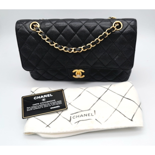 31 - A VINTAGE BLACK CAVIAR LEATHER CHANEL FLAP BAG. 24K GOLD PLATED HARDWARE. LOVELY INTERIOR POCKETS CO... 