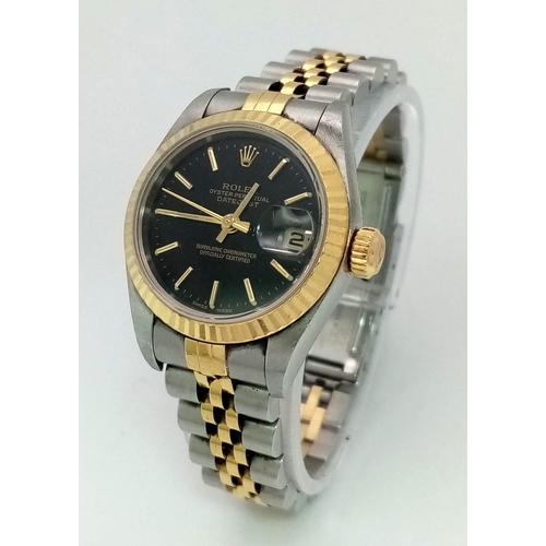 36 - A Bi-Metal Rolex Oyster Perpetual Datejust Ladies Watch. Bi-metal bracelet and case - 26mm. Black di... 