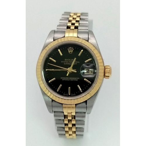 36 - A Bi-Metal Rolex Oyster Perpetual Datejust Ladies Watch. Bi-metal bracelet and case - 26mm. Black di... 